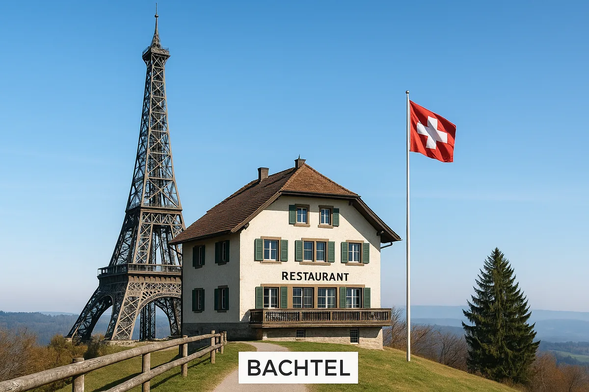 Man sieht den Eifelturm neben einem Gebäude, auf dem Restaurant steht.